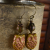 Gold colored owl earrings with brass from Gloria Ewing.