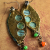 Mixed metals and colorful trade bead dangles by Gloria Ewing.