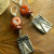 Boho Pewter Earrings Bohemian pewter charms with orange flowers by Gloria Ewing.