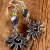 Tribal Sun Charm Earrings Striking spiral sun beaded earring design by Gloria Ewing.