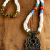 Nomadic African tribal style necklace with artisan bronze pendant.