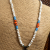 Tribal necklace design with bronze Tanfouk pendant by Gloria Ewing.