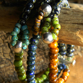 Alternating loop focals in each of 3 strands by Gloria Ewing.