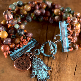 Earthy colors in a multi-strand bracelet design by Gloria Ewing.