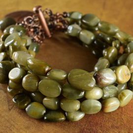 Rustic copper and green cats eye multi design by Gloria Ewing.