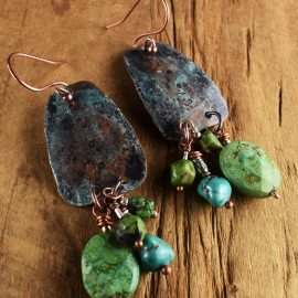 Green and blue turquoise in a copper earring design by Gloria Ewing.
