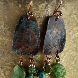 Turquoise with patina copper in an asymmetrical design by Gloria Ewing.