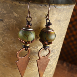 Green lampwork glass with hammered copper by Gloria Ewing.