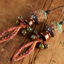 Handmade glass and patina pewter earrings from Gloria Ewing.