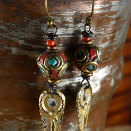 Inlaid beads and artisan charms in an earring design by Gloria Ewing.