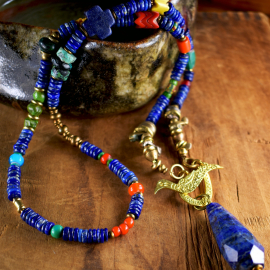 Beaded lapis lazuli with teardrop pendant by Gloria Ewing.