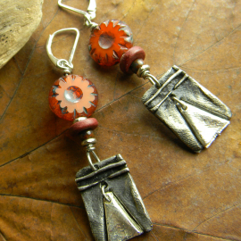 Bohemian pewter charms with orange flowers by Gloria Ewing.