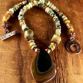 Unusual marquise shaped polychrome pendant necklace with cat's eye beads.