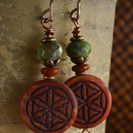 Rust clay and subtle blue with copper in earrings by Gloria Ewing.
