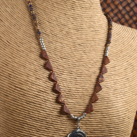 Earthy Czech beads with spiral pendant from Gloria Ewing.